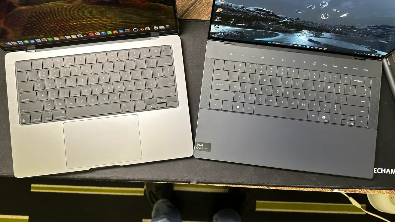 标题为 Apple MacBook Pro 14 与 Dell XPS 14：谁在舒适性和创造力方面获胜