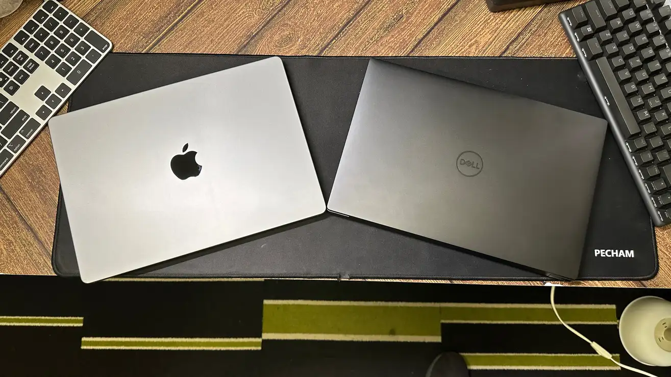 标题为 Apple MacBook Pro 14 与 Dell XPS 14：谁在舒适性和创造力方面获胜