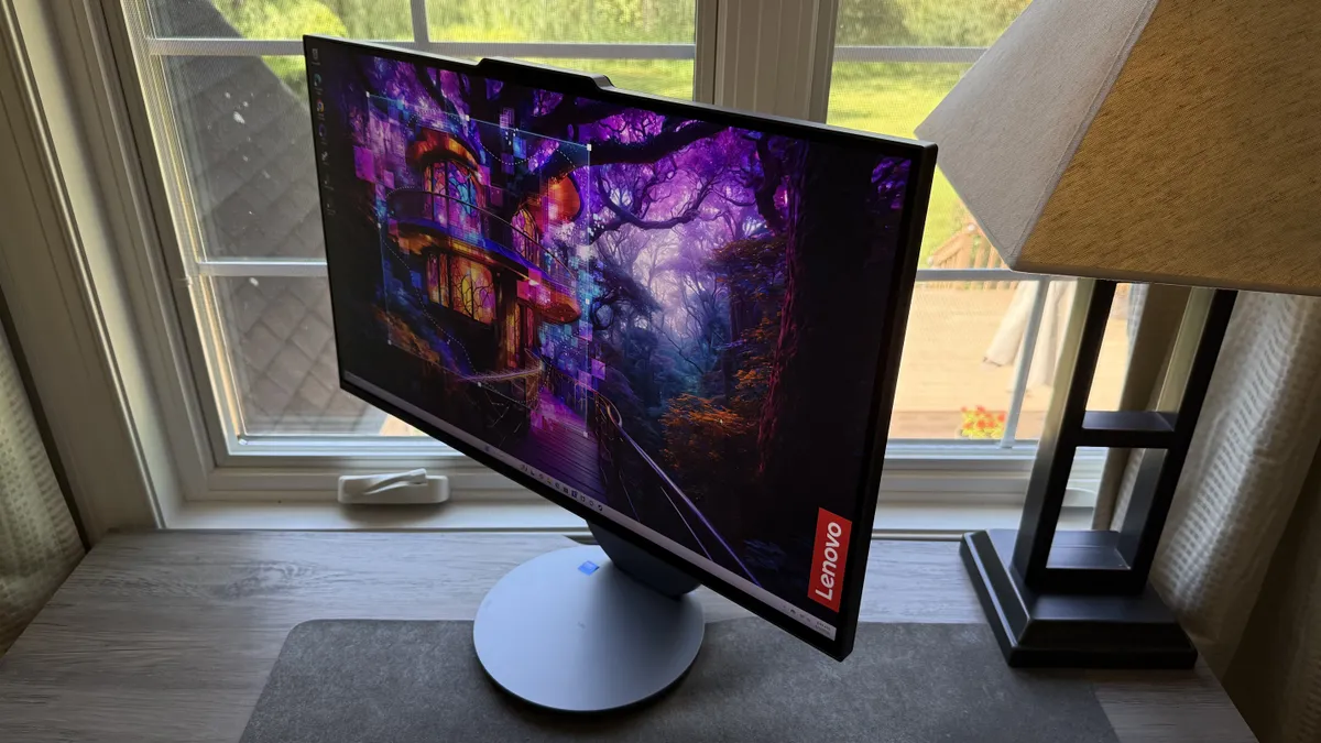 桌面上放着一台联想 Yoga AIO 27 笔记本电脑 桌面上放着一台联想 Yoga AIO 27 笔记本电脑